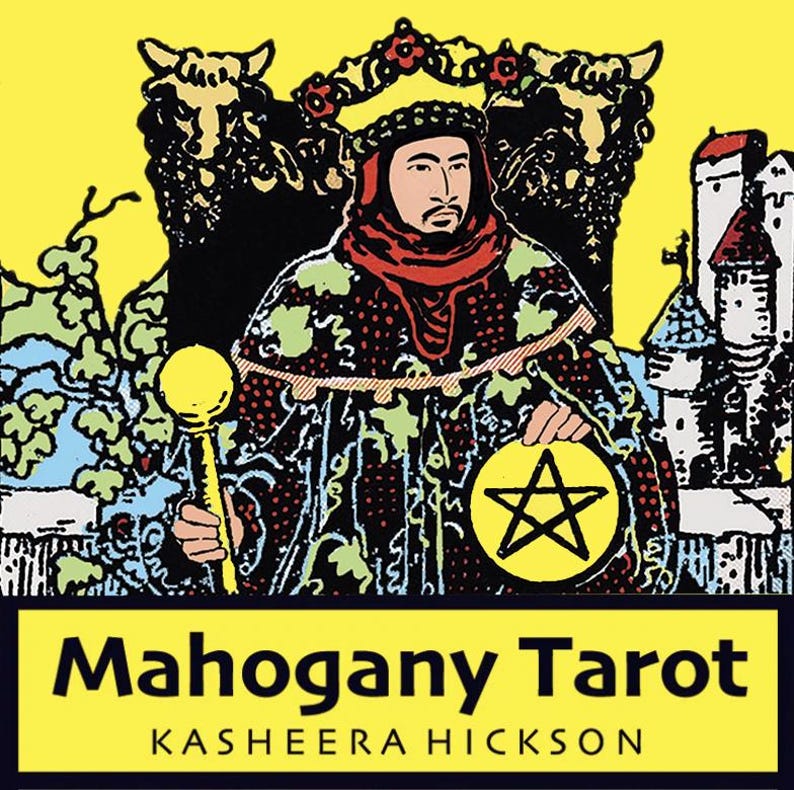 May include: A tarot card illustration featuring a robed figure holding a golden scepter and a pentacle. The card has a yellow background with the text "Mahogany Tarot" and the name "Kasheera Hickson". The figure is wearing a crown and a red scarf.