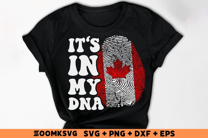 Pode incluir: Camiseta preta com texto branco que diz "It's in my DNA" e um design de impress&atilde;o digital com as cores da bandeira canadense.