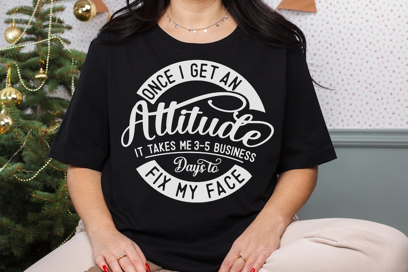 May include: Black t-shirt with a white graphic that says "Once I get an Attitude it takes me 3-5 business days to fix my face."