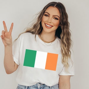 May include: A white t-shirt with a green, white, and orange Irish flag design.