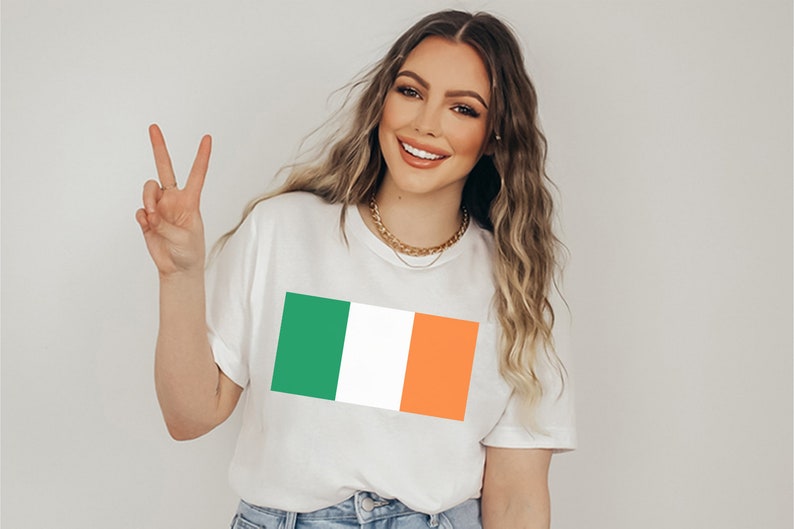 May include: A white t-shirt with a green, white, and orange Irish flag design.