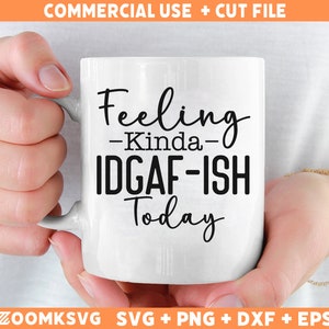 May include: White ceramic mug with black text that reads "Feeling -Kinda- IDGAF-ISH Today".