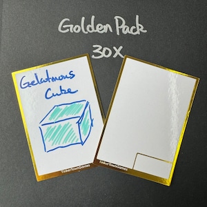 May include: Two white cards with gold trim. The card on the left has a blue and green drawing of a cube and the text "Gelatinous Cube" written in blue ink. The card on the right is blank except for the text "TinkerTownGames" in black ink. The text "Golden Pack 30x" is written in white ink on a black background.