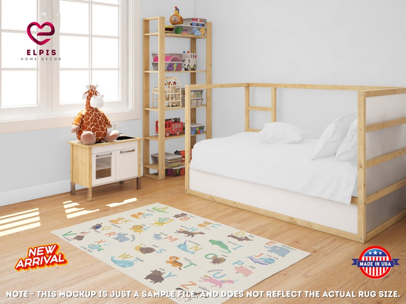 May include: A colorful alphabet rug with animal illustrations. The rug features a light beige background with colorful letters and animals, including a giraffe, a whale, a lion, a zebra, and a crocodile. The rug is laid out on a wooden floor in a child's bedroom.
