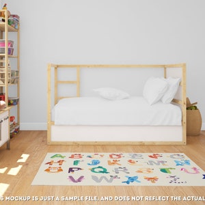 May include: A white and beige alphabet rug with colorful animal illustrations and letters. The rug is in a child's bedroom with a wooden bed and a bookshelf.