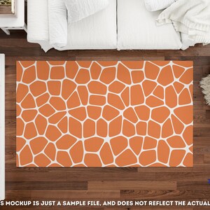 May include: Orange and white geometric patterned area rug with a white background and orange shapes.