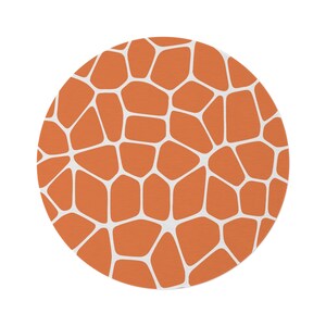 May include: A round orange and white patterned rug with a geometric design.