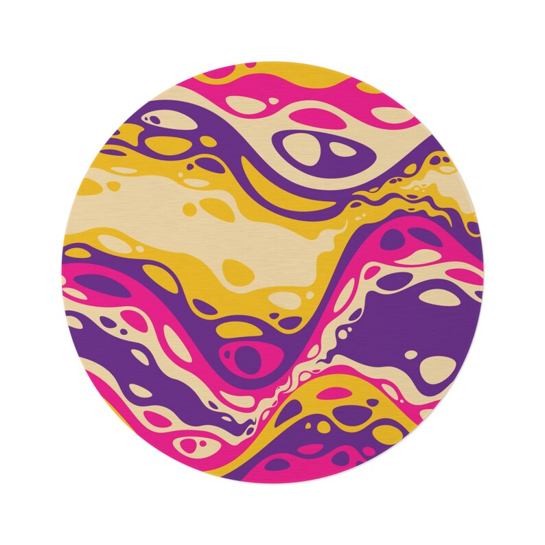 May include: Abstract circular design with swirling patterns in shades of yellow, pink, and purple.