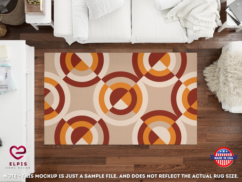 May include: A beige area rug with a geometric pattern of overlapping circles in shades of orange, red, and white.