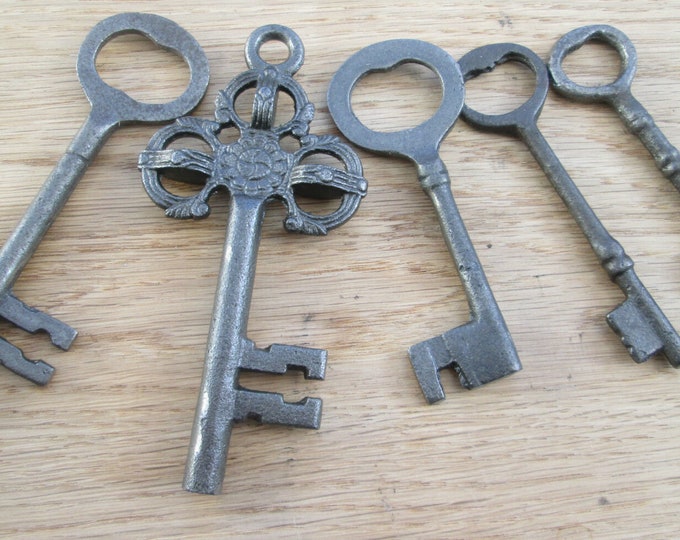 Old vintage victorian style ornate fancy rustic old cast iron garden decorative ornamental door hanging keys