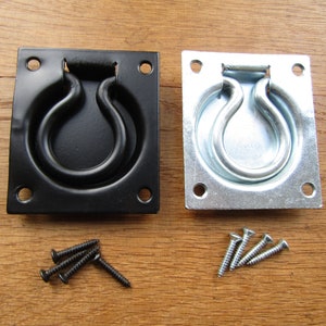 May include: Two square metal ring pulls, one black and one silver, with four screws for each.