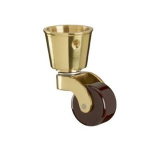 May include: Brass furniture caster with a brown rubber wheel. The caster has a cup-shaped top and a threaded stem.