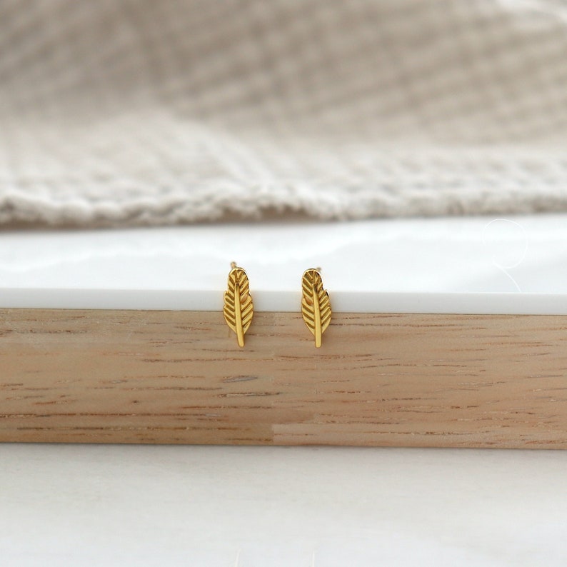 Stud earrings in the shape of gold or silver feathers, minimalist women's stud earrings, gift ideas image 1