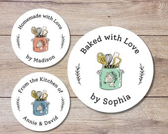 May include: Three round white stickers with black text and illustrations of kitchen utensils in a jar. The first sticker says "Homemade with Love by Madison". The second sticker says "From the Kitchen of Annie & David". The third sticker says "Baked with Love by Sophia".