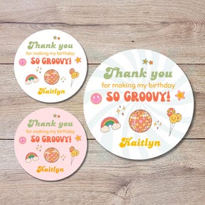 May include: Three round stickers with a retro design. The stickers feature the text "Thank you for making my birthday SO GROOVY!" and the name "Kaitlyn". The stickers also include a rainbow, disco ball, and balloons.