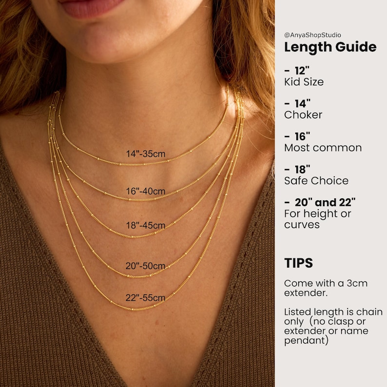 May include: Five gold satellite chains layered on a neck, labeled with lengths from 14 inches to 22 inches. The text guide lists lengths: 12 inch kid size, 14 inch choker, 16 inch most common, 18 inch safe choice, and 20 to 22 inch for height or curves.