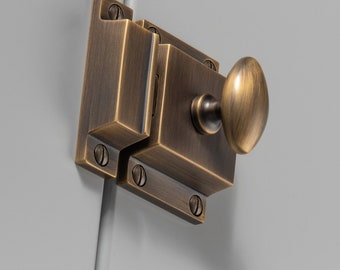 Solid Brass elegant cupboard latch with a oval turn, timeless aesthetic, elevating the appearance of any cupboard , draw , cabinet