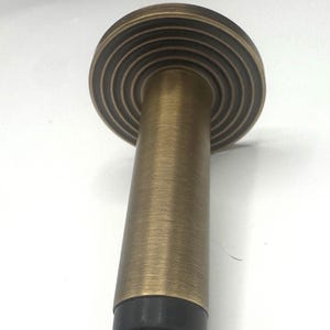 Bespoke brass door stop with variety of styles and finishes. design your own door stop to suit your home perfectly. wall mounted