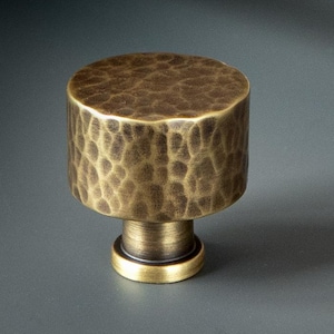 Solid Brass Hammered Cabinet knob , a circular knob on a pedestal. Heavy weight, quality knob idea for both traditional and modern homes.