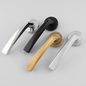 May include: Four door handles in different finishes: chrome, black, brass, and nickel. Each handle has a curved design and a round base.