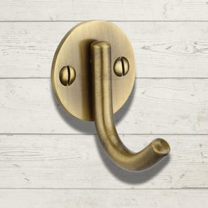 Modern Brass Single Robe Hook on round back plate with matching screws . perfect for bathroom , kitchen , hall way . towel hook ,solid brass