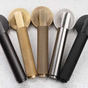 Solid Brass Door Handle the Masano smooth lever on round rose. Heavy weight chunky handle