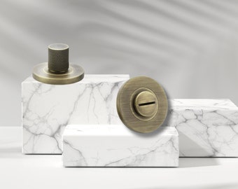 Cerradura de privacidad moleteada con giro y liberación para baños