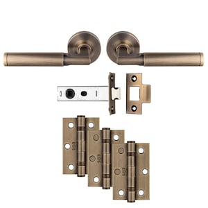 May include: Antique brass door hardware set including two door handles, a latch, and three pairs of hinges. The hinges are labelled "E68S".