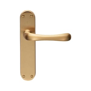 May include: A brushed gold door handle with a curved lever and a rectangular backplate. The handle has two small screws on the backplate.
