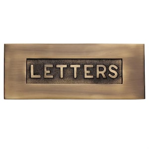 Placa de letras de latón macizo en relieve