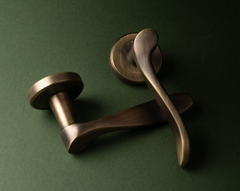 Verdum Lever On Rose, A pair of door handles classic scroll lever , curved smooth and nice in the hand , on round rose