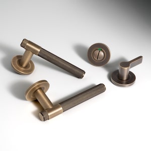 The Kingston Knurled lever on round rose. Sold Brass luxurious lever handle finishes off a contemporary design.