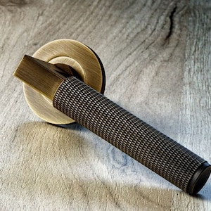 This luxurious Hurricane Knurled pair of door handles on concealed rose ,high end heavy weight solid brass lever handle  contemporary,