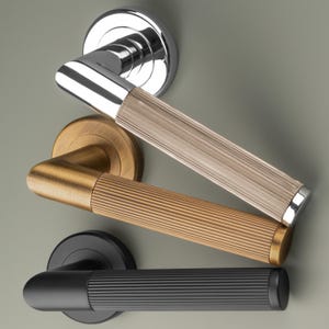 Lines Lever on Round Rose Door Handle. Pair of door handles on concealed rose perfect contemporary design. Ribbed for extra grip