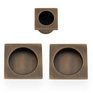 Sliding door Passage set . crafted from brass , available in round flush pulls or square , with edge finger pull. pocket door set