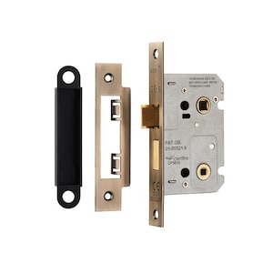 May include: A brass door lock with a black strike plate. The lock has a keyhole, a lever handle, and a deadbolt. The lock is labeled with the text "PAT. GB. 01-05521.9" and "certifire CF5610".