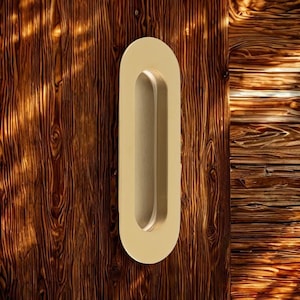A radius shaped low profile flush pull which is used mainly on sliding doors. For use on doors, wardrobes or cupboards. pocket doors