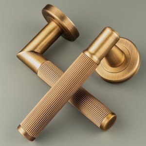 Stunning New Lines Lever on Round Rose Door Handle. Pair of door handles on concealed rose perfect contemporary design