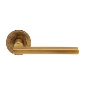 May include: A gold-toned door handle with a round knob and a rectangular lever.