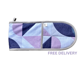 Guante de cocina doble geométrico: Agarradera de algodón estilo art déco en morado y gris con asa para colgar.