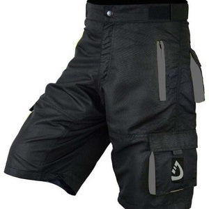 May include: Black cargo shorts with a zippered pocket and a reflective logo on the right leg.