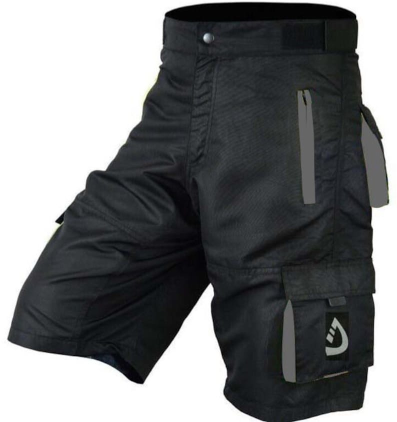 May include: Black cargo shorts with a zippered pocket and a reflective logo on the right leg.