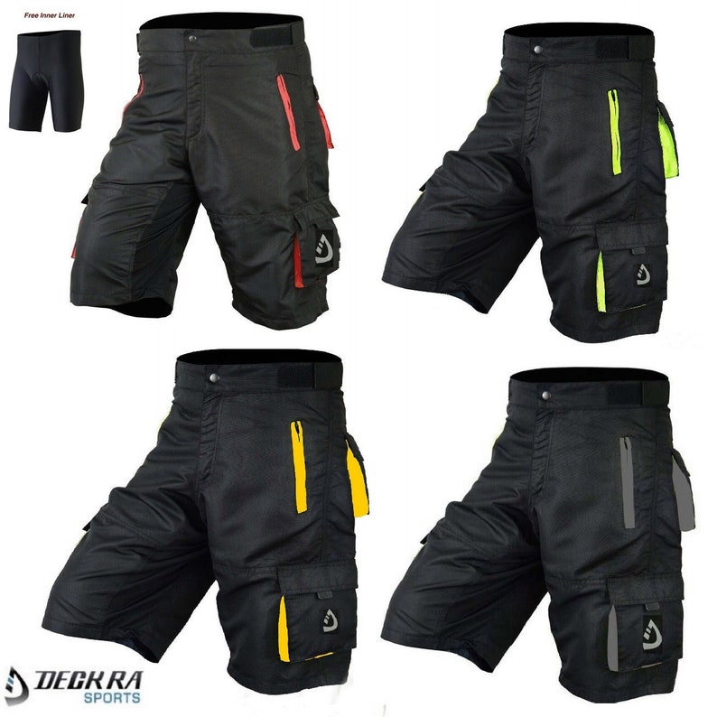 May include: Four pairs of black cycling shorts with different colored accents. The shorts have a zippered pocket on the right leg and a large cargo pocket on the left leg. The shorts have a black inner liner.
