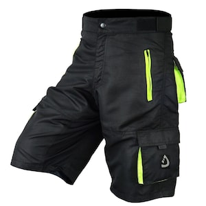 May include: Black cargo shorts with neon green accents and a zippered pocket. The shorts have multiple pockets and a button closure.