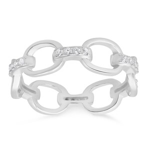 May include: A silver ring with a chain design and small clear stones set in the band.