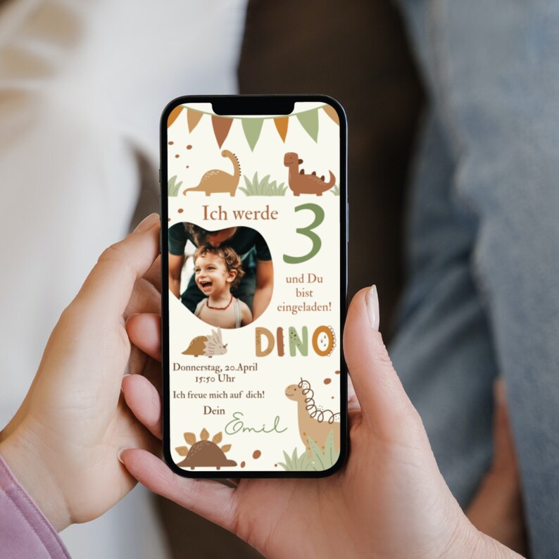 May include: A mobile phone screen displaying a birthday invitation with a dinosaur theme. The invitation features a photo of a young child, a dinosaur illustration, and the text "Ich werde 3 und Du bist eingeladen! DINO".