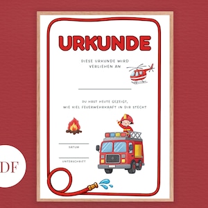 Pode incluir: Certificado emoldurado com uma borda vermelha e a palavra "URKUNDE" no topo. O certificado apresenta ilustrações de um helicóptero, um carro de bombeiros e um bombeiro. O texto inclui espaços para nome, data e assinatura.