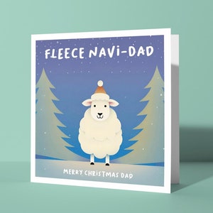 May include: A white greeting card with a cartoon sheep wearing a Santa hat, set against a snowy forest scene. The card reads "FLEECE NAVI-DAD" and "MERRY CHRISTMAS DAD" in white text. The background is a gradient of blue and white.