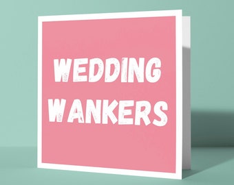 May include: A pink card with the text "Wedding Wankers" in white lettering.