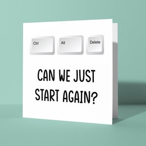 May include: White card with three computer keys labelled "Ctrl", "Alt", and "Delete". The text "CAN WE JUST START AGAIN?" is printed below the keys.